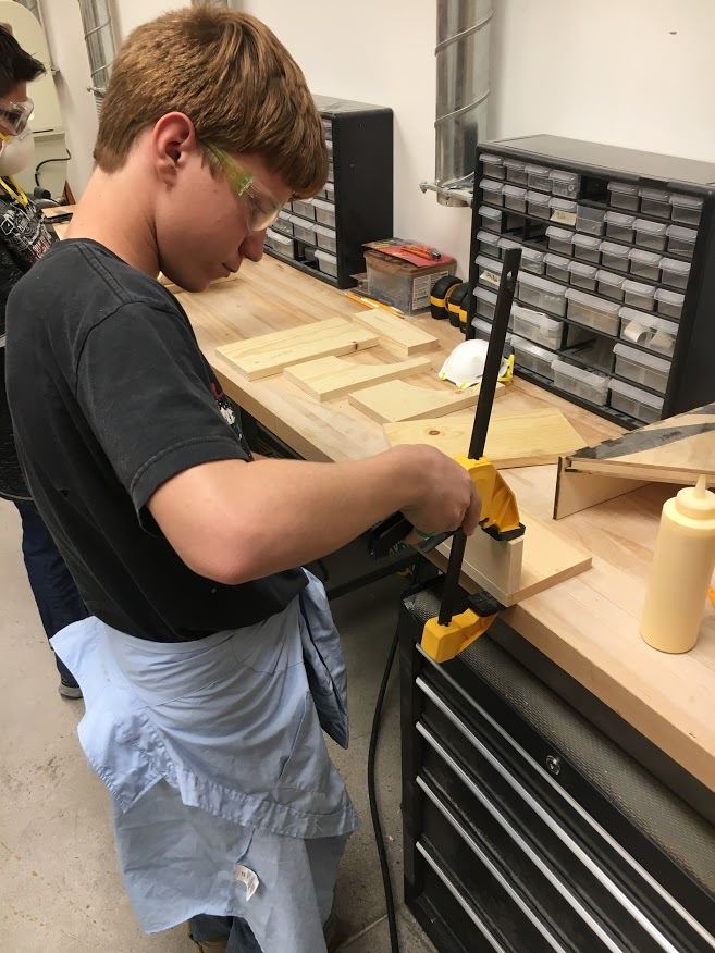 Boy working in woodshop
